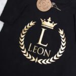 Koszulka czarna z krótkim rękawem złoty wieniec Leon rozmiar 110