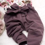 Spodnie dla dziewczynki z ozdobnym wiązaniem kolor brudny wrzos