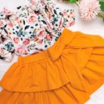 Pomarańczowa spódniczka z falbankami i kokardą