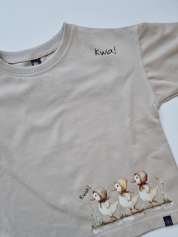 Koszulka beżowa krótki rękaw kaczuszki rozmiar 86