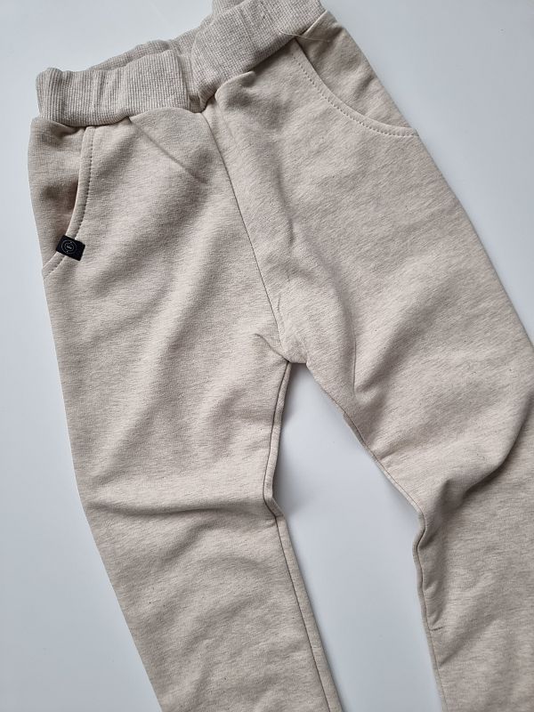 Spodnie dresowe beż melanż rozmiar 104