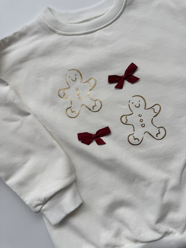 Bluza ecru pierniczki i kokardki rozmiar 110