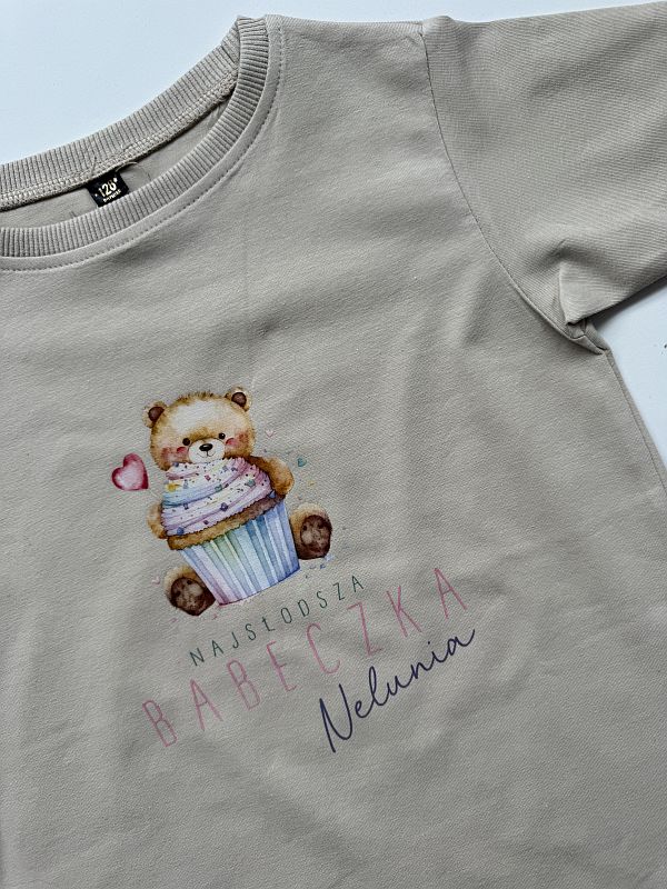 Koszulka beżowa krótki rękaw najsłodsza babeczka Nelunia rozmiar 128