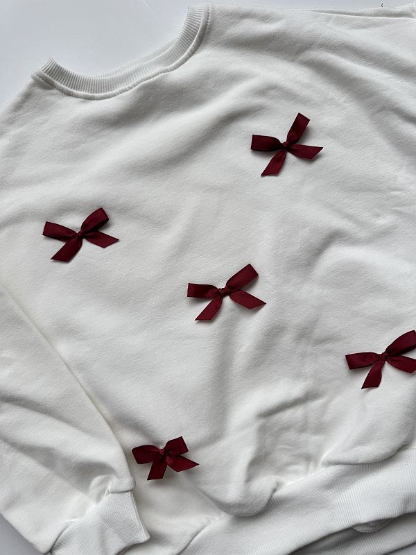 Bluza ecru z kokardkami 122