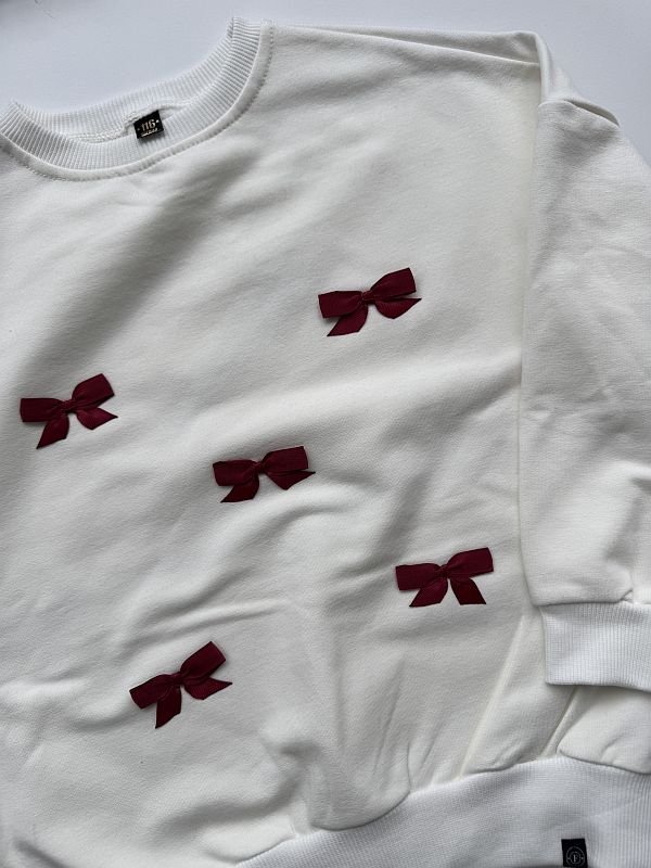 Bluza ecru w bordowe kokardki rozmiar 116