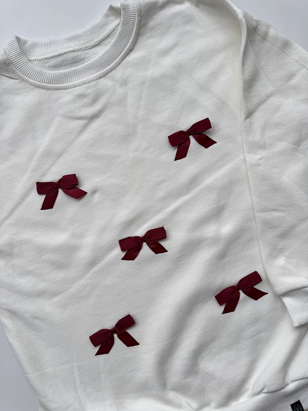 Bluza ecru w bordowe kokardki rozmiar 122