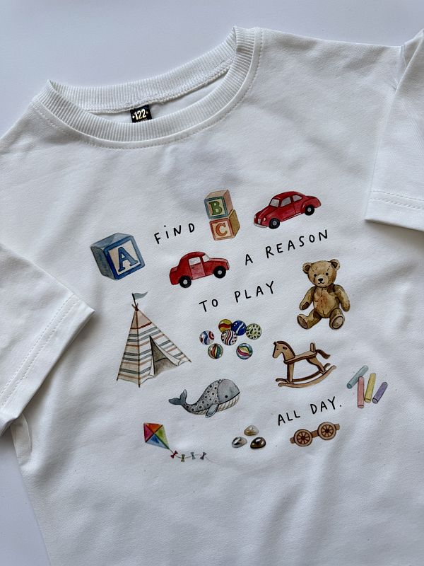 Koszulka oversize ecru z nadrukiem zabawek rozmiar 122