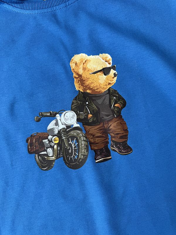 Koszulka niebieska z krótkim rękawem miś przy motorze rozmiar 122