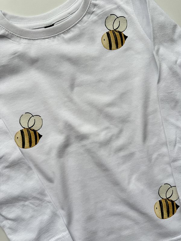 Koszulka biała z długim rękawem pszczółki rozmiar 110