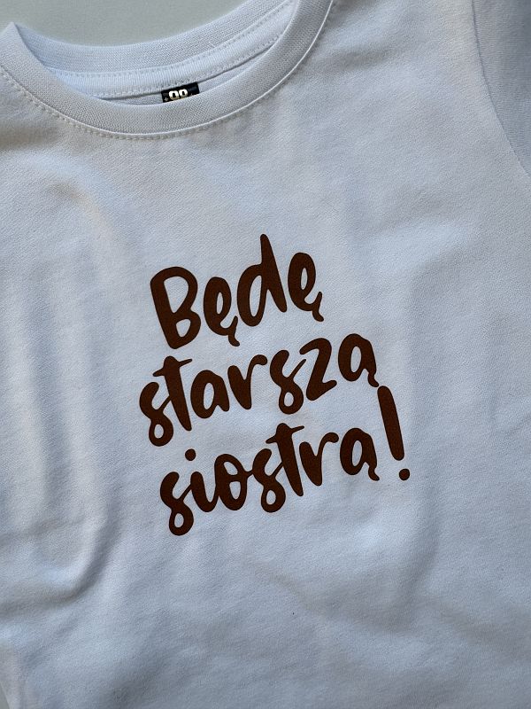Koszulka biała z krótkim rękawem będę starszą siostrą rozmiar 98