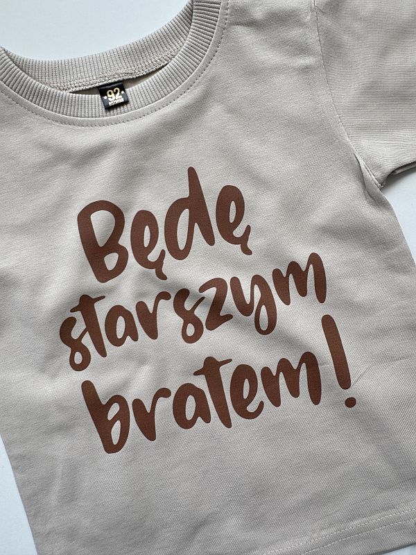 Koszulka beżowa z krótkim rękawem będę starszym bratem rozmiar 92