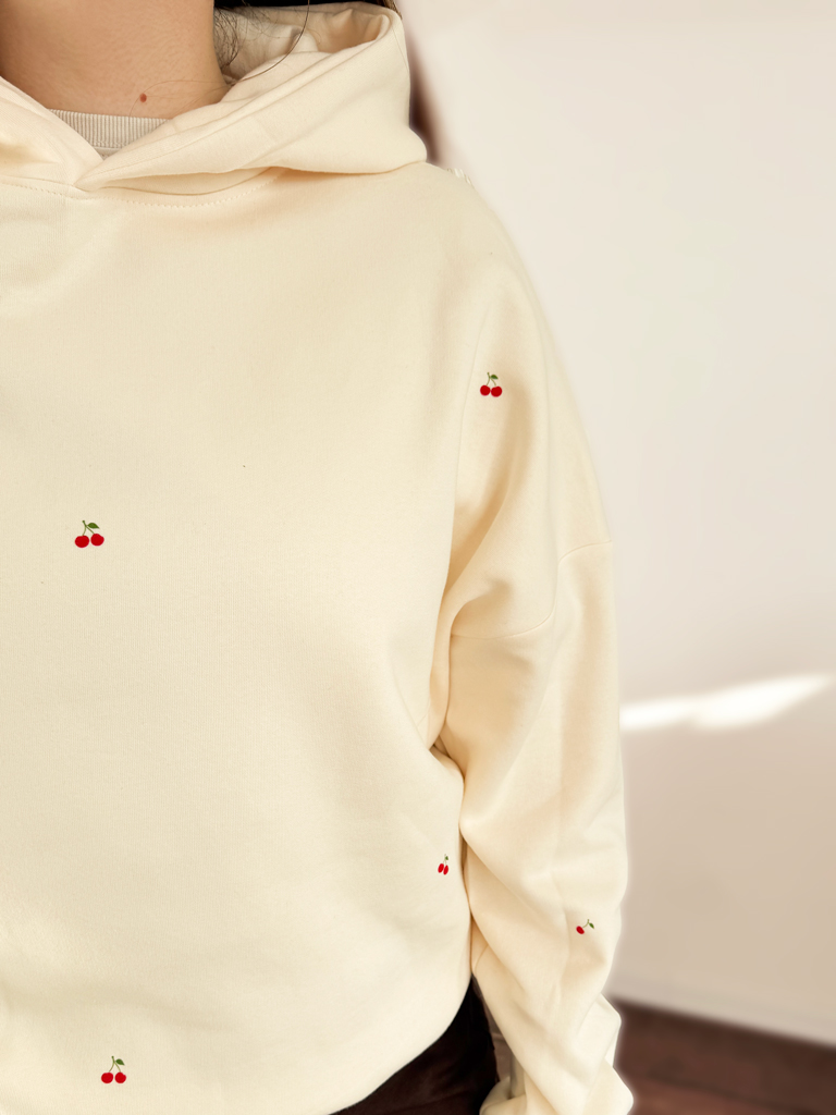 Bluza damska z kapturem waniliowa z nadrukiem wisienek