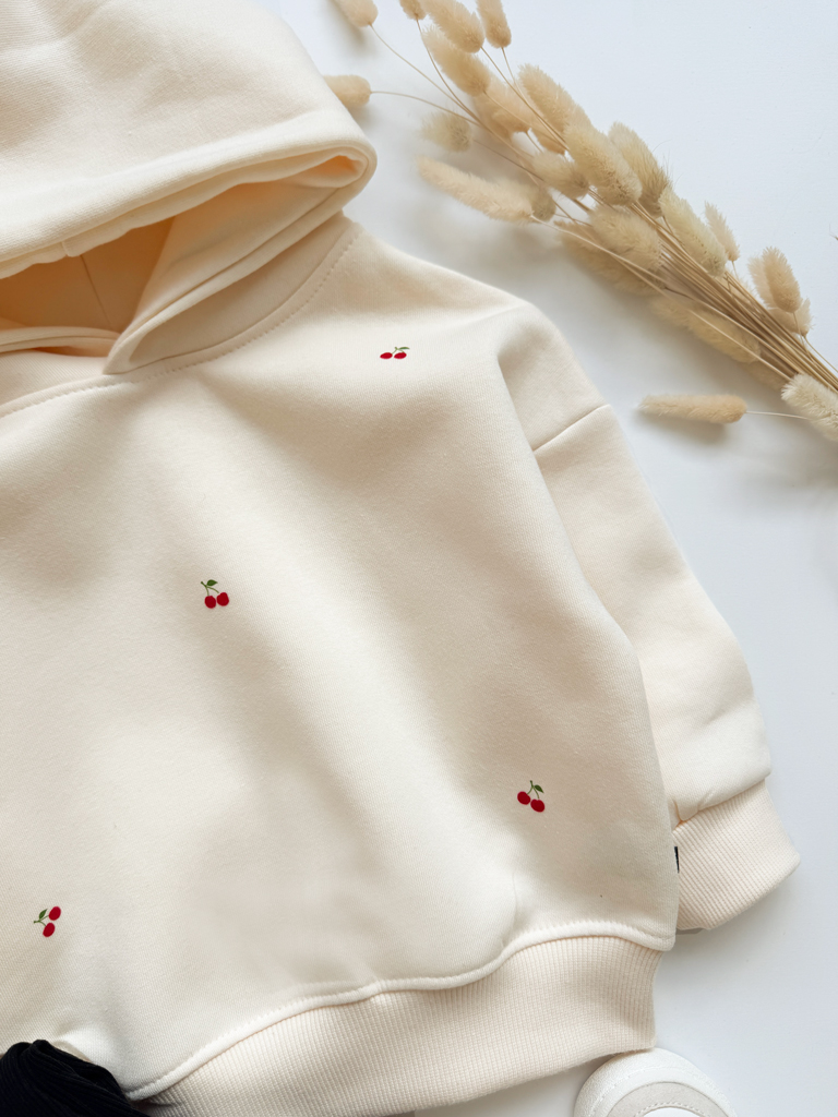 Bluza dziecięca z kapturem waniliowa z nadrukiem wisienek